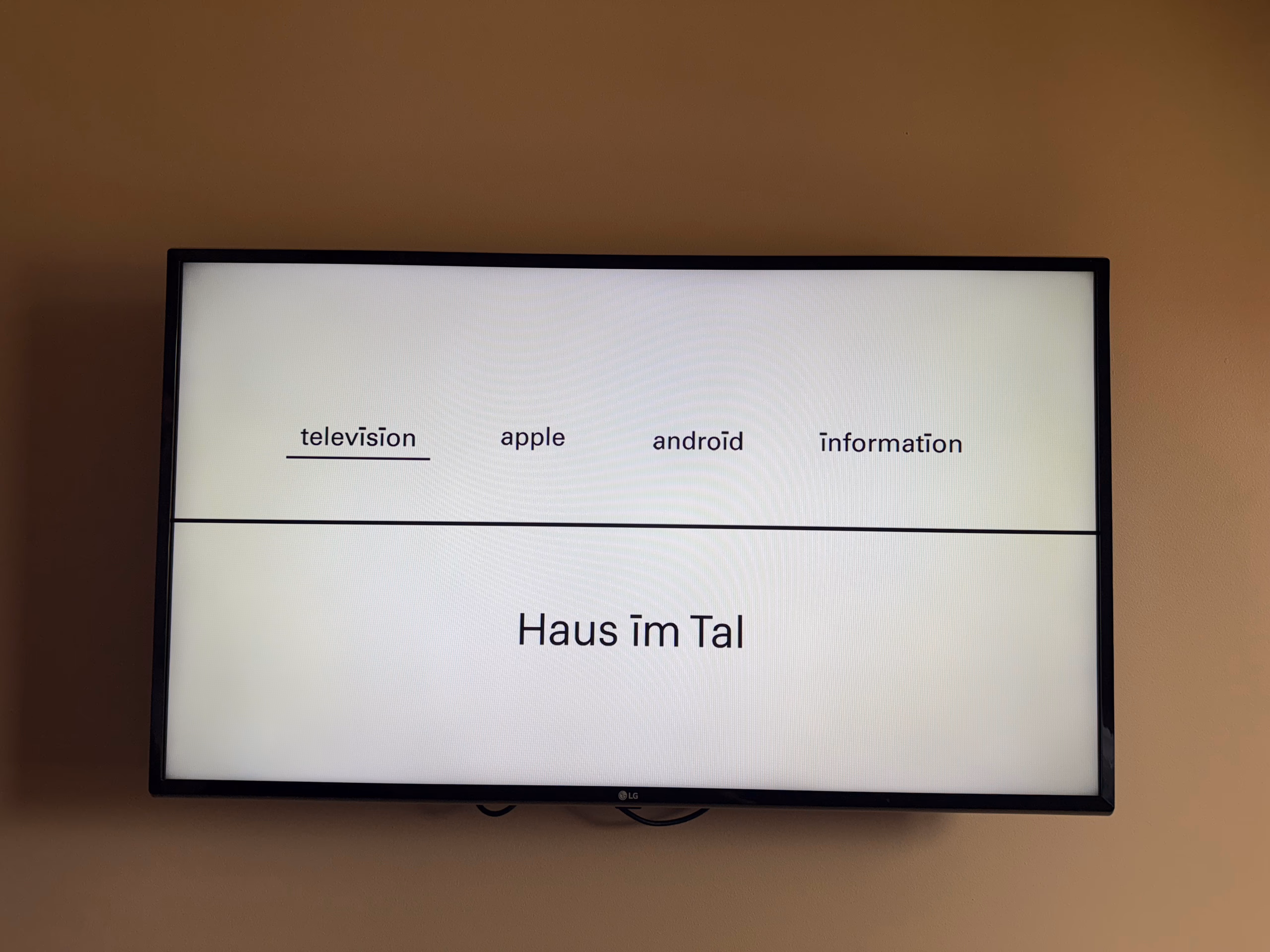 Haus im Tal TV menu with Television, Apple, Android and Information options